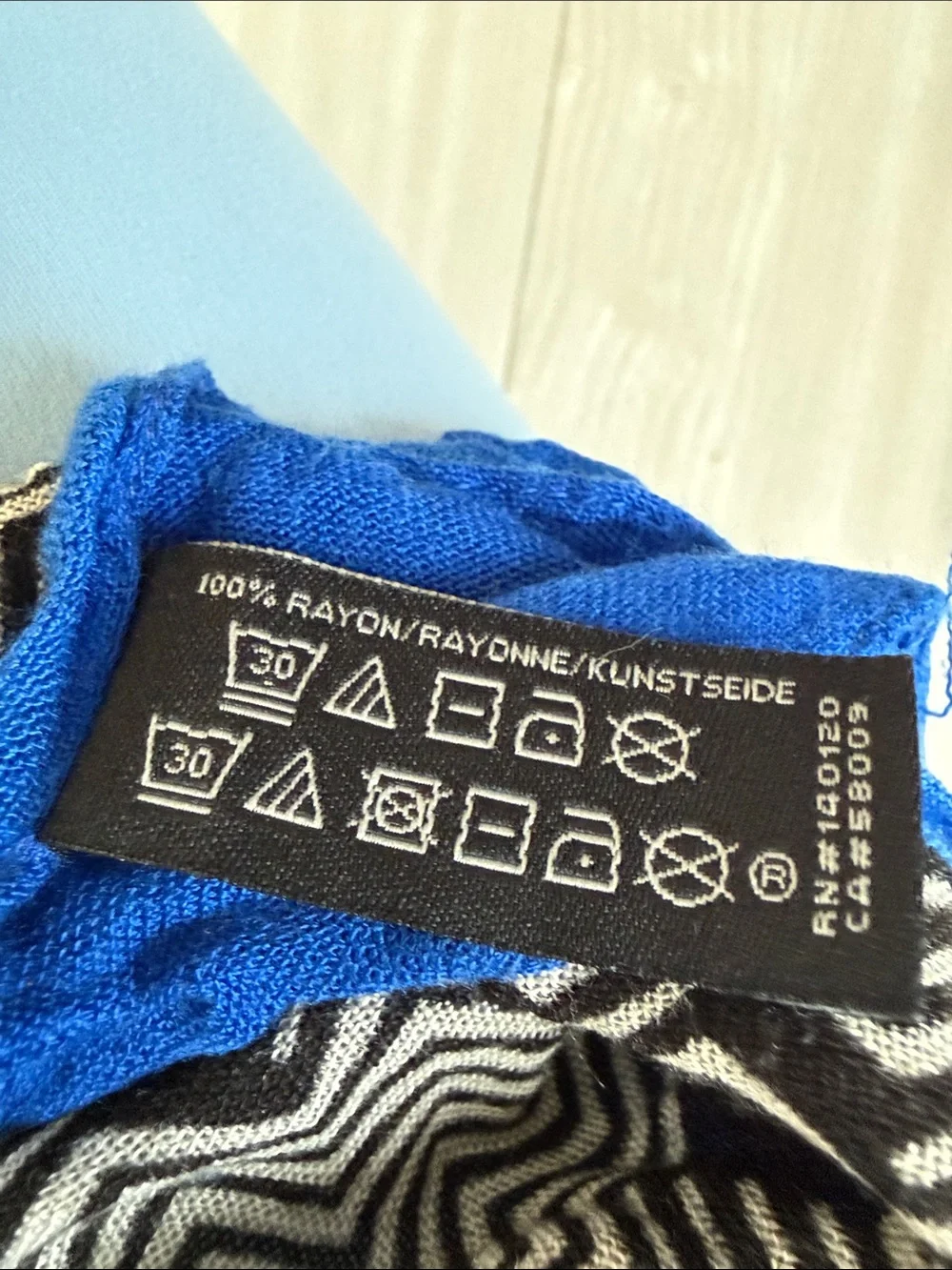 Stella & Dot Black and White Floral Sheer Scarf with Blue Edge.